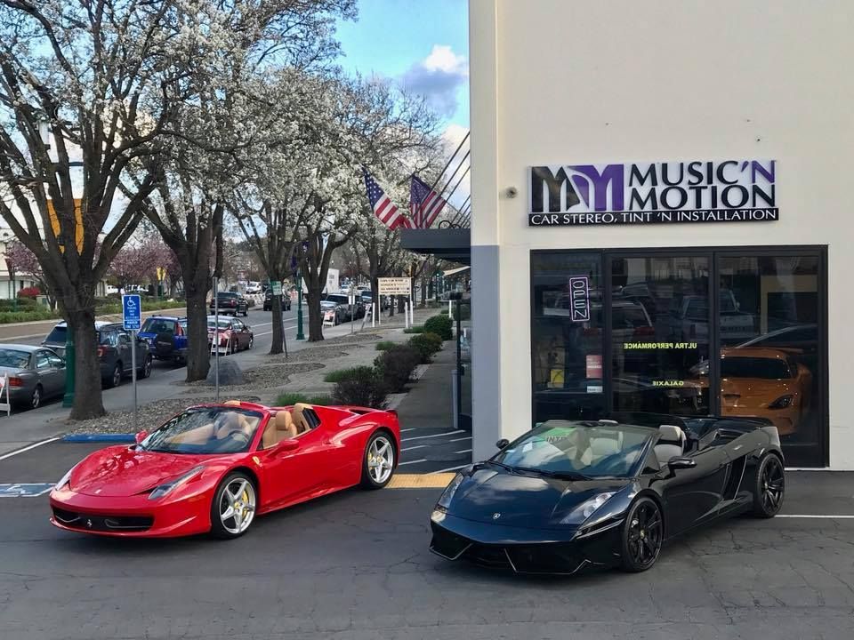 Music'n Motion store front photo with sports cars