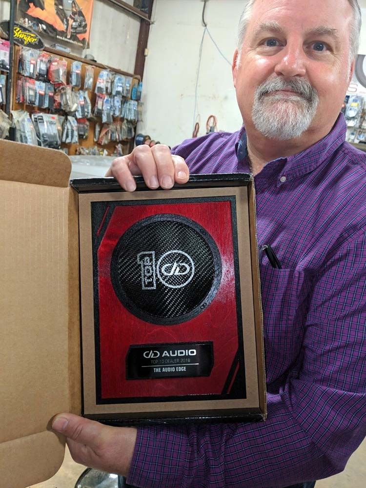 Photo of Audio Edge owner with Top 10 DD award.