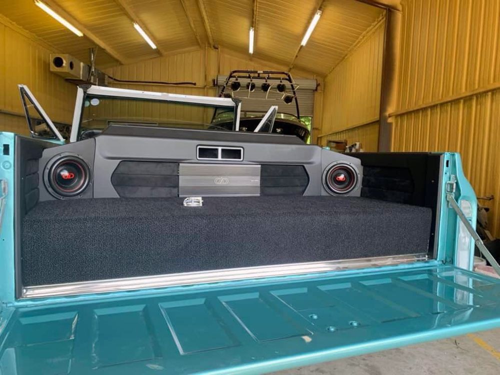 Photo of custom loaded enclosures made by Pyramid Customs with DD subs and amp