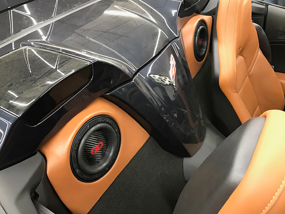 Photo of DA BASS custom install subs behind seats