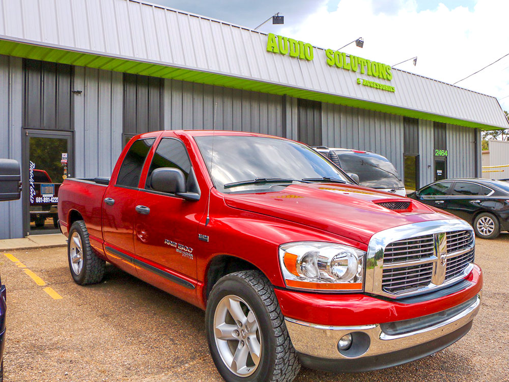 Photo Audio Solutions and Accessories storefront with truck in shot